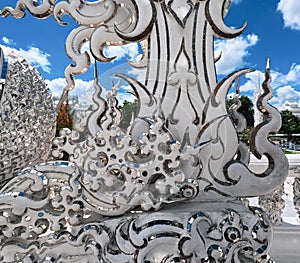 Hand-carved facade details of Wat Rong Khun Buddhist Temple