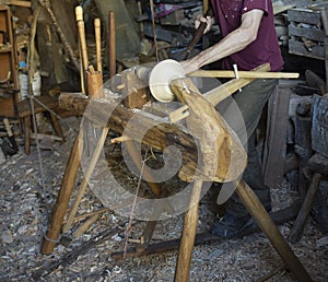 Hand carving a wooden bowl
