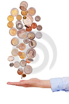 Hand catches falling coins photo