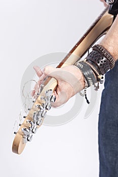 Hand of Caucasian Male Guitar Player Posing Against White.