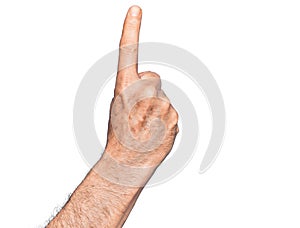 Hand of caucasian middle age man over isolated white background counting number one using index finger, showing idea and