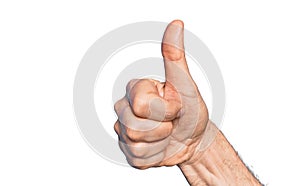 Hand of caucasian middle age man over isolated white background doing successful approval gesture with thumbs up, validation and