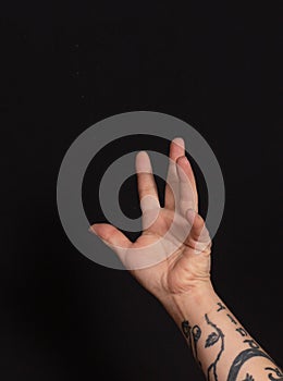 hand of a caucasian person reaching out for something or someone
