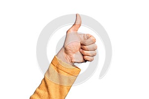 Hand of caucasian young man showing fingers over isolated white background doing successful approval gesture with thumbs up,