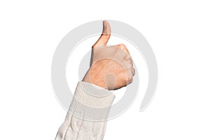 Hand of caucasian young man showing fingers over isolated white background doing successful approval gesture with thumbs up,