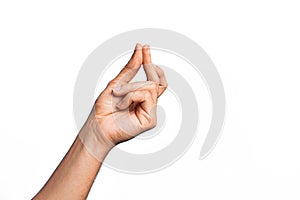 Hand of caucasian young man showing fingers over isolated white background snapping fingers for success, easy and click symbol