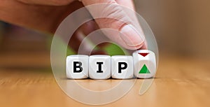 Hand changes the orientation of an arrow next to the abbreviation BIP.