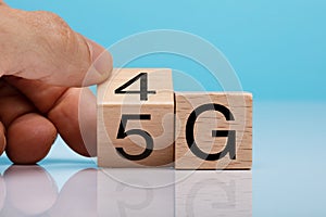 Hand Changing Wooden Block From 4g To 5g