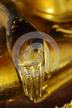 Hand character of golden image of buddha in the attitude of subduing Mara in Wat Pho temple