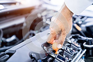 Hand checking engine oil, change oil car engine