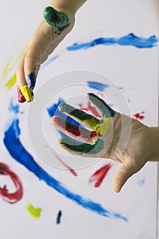 Hand of child while doing fingerpaint.