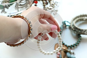 Hand is choosing bracelet