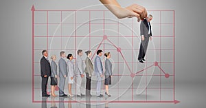 Hand choosing a business man on grey background with graph and business people