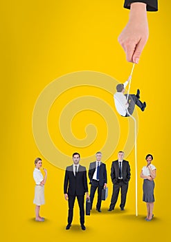 Hand choosing a man with a rope on a yellow background with business people
