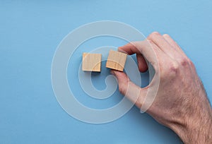 Hand choosing a wooden block from a set. Business choice concept