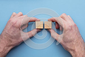 Hand choosing a wooden block from a set. Business choice concept