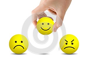 Hand choosing yellow smile emotional icons for giving best service ranking on white background.