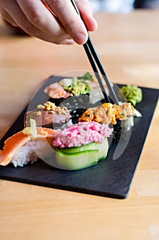 Eating nigiri sushi photo
