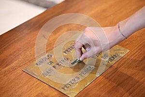 Hand of the Christian making an offering called Peter s pence in the Basilica