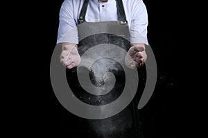 Hand clap of chef with flour on black background isolated