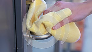 Hand cleaning doorhandle with detergent and rag
