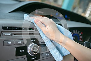 Hand cleaning Interior modern car with Microfiber and cleaning console car