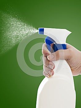 Hand With Cleaning Spray Bottle photo