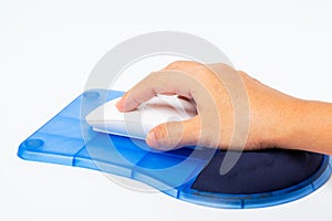 Hand click on Wireless computer white mouse on the Mouse pad