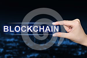 Hand clicking blockchain button