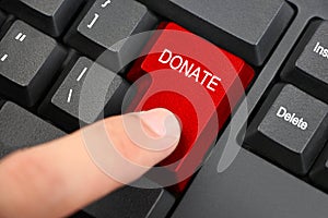 Hand Clicking Donate Button