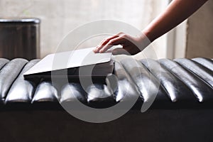 A hand close or open a laptop computer, getting ready for work