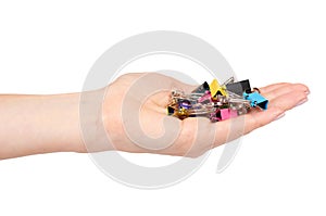 Hand with color paper cilp, office accessory, fastener for notes
