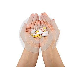 Hand and colorful medicines on a white background