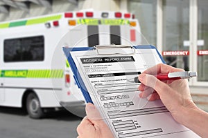 Hand Completing an Accident Report Form by Ambulan