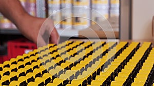 Hand completing an array of electronic components at production facility