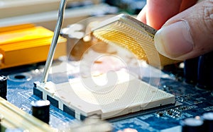 Hand of computer engineering brings computer cpu processor memory change components into socket processor for maintenance.