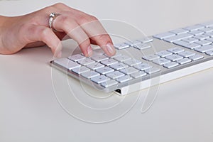 Hand on computer keyboard