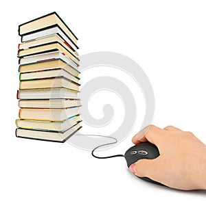Hand with computer mouse and books
