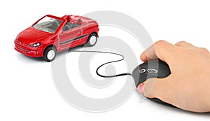 Hand with computer mouse and car