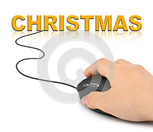 Hand with computer mouse and Christmas
