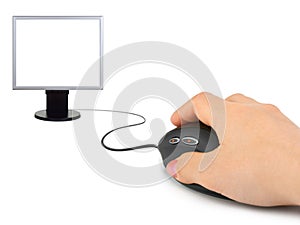 Hand with computer mouse and monitor