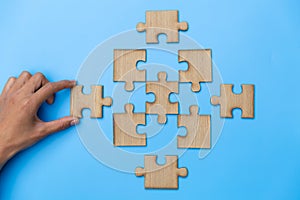 Hand connect jigsaw parts with word problem  solution.   symbol of association and connection. business strategy. Teamwork concept