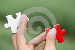 Hand connect white and red jigsaw parts with word problem & solution.   symbol of association and connection. business strategy.