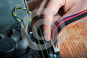 Hand Connecting Power Cable to Computer Motherboard: Technology Concept Image