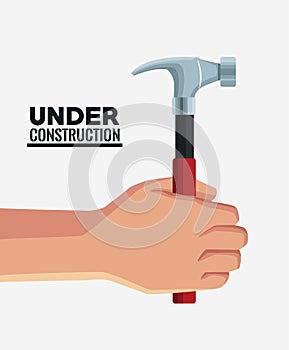 Hand with construction tool