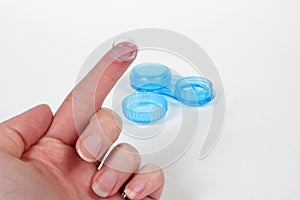 Hand with contact lens