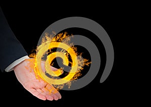 hand with copyrighht fire icon over. Black background