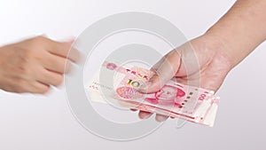 Hand counting passing Chinese yuan money currency , hand giving money RMB banknotes Chinese yuan moneybanknotes