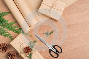 Hand crafted Christmas present gifts box and tools on wooden background