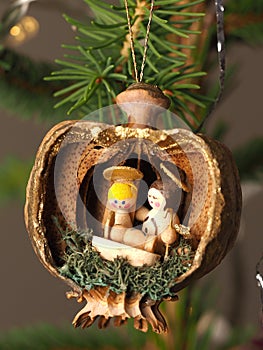 Hand crafted traditional Christmas decoration made of a Poppy capsule and showing the holy family